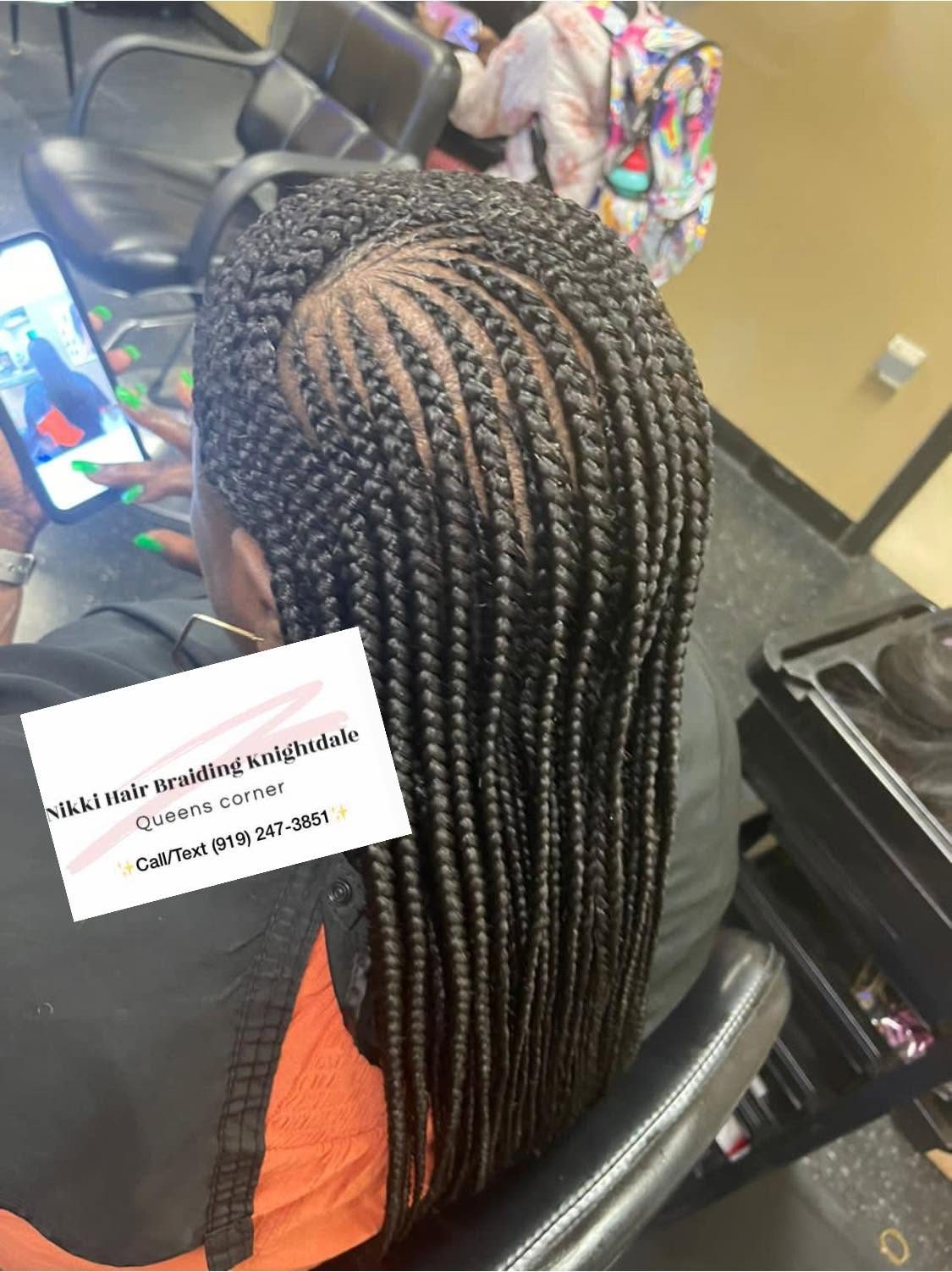 Long box braids hairstyle displayed at Nikki Hair Braiding Knightdale salon