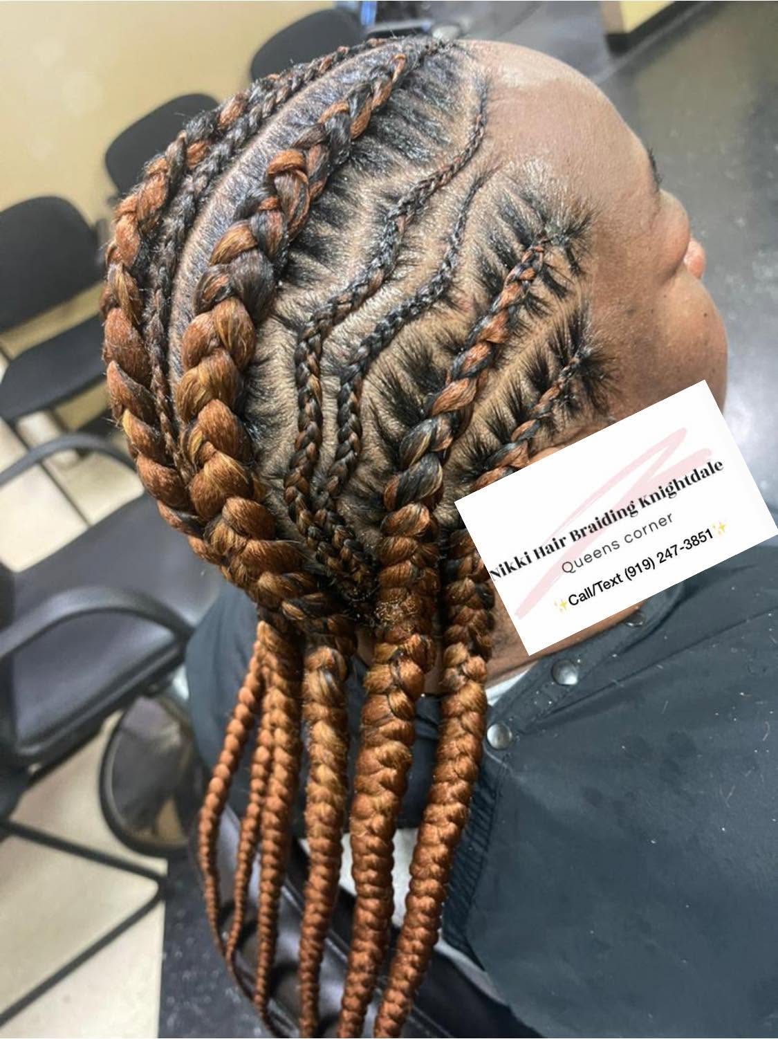 Back view of intricately braided hair with copper and black tones featuring multiple plaited sections